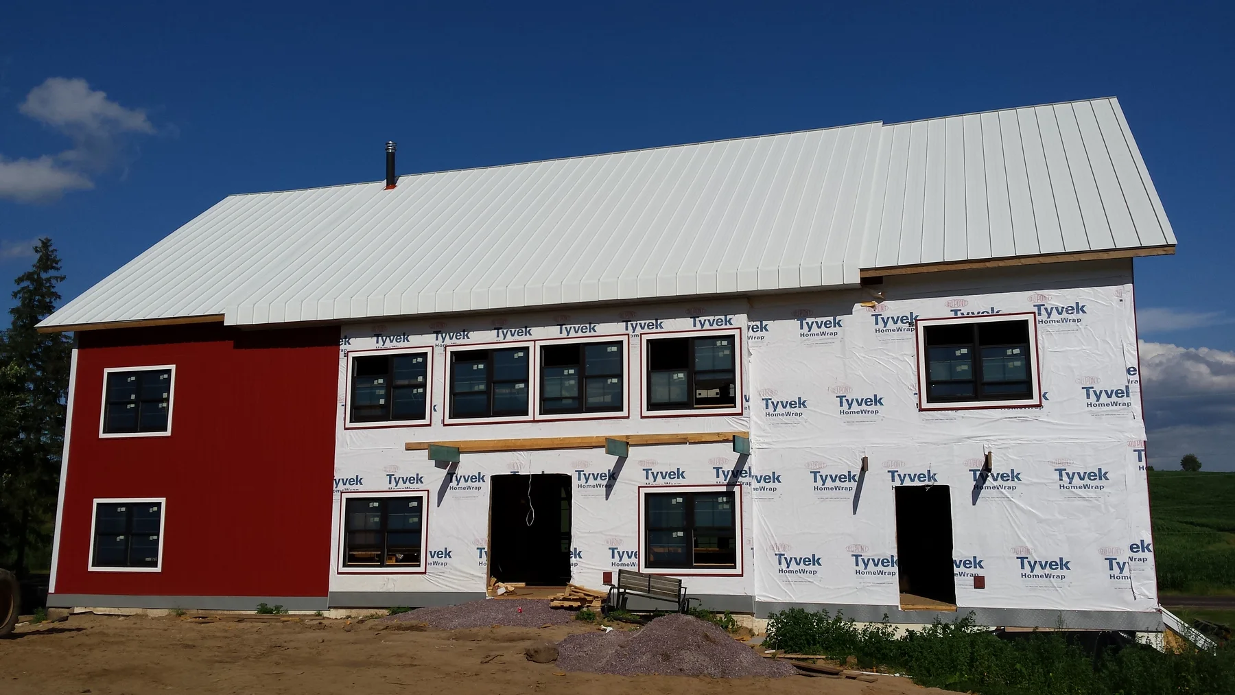 The front elevation during exterior work, before siding was complete.
