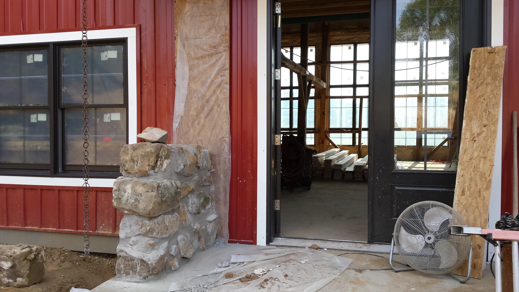 Stonework and entry framing coming together at the front door.