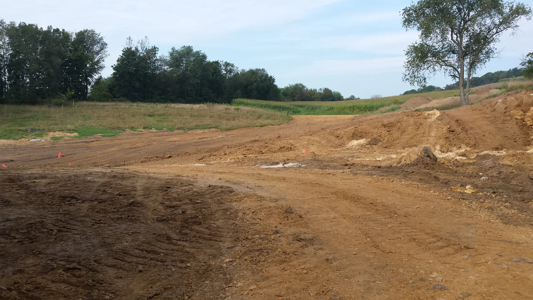 Site work around the new drive and lawn.