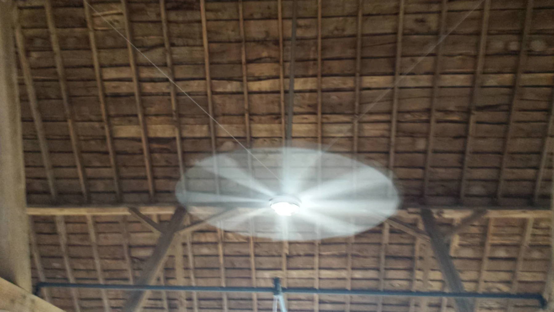 The original roof structure and new light fixture overhead.