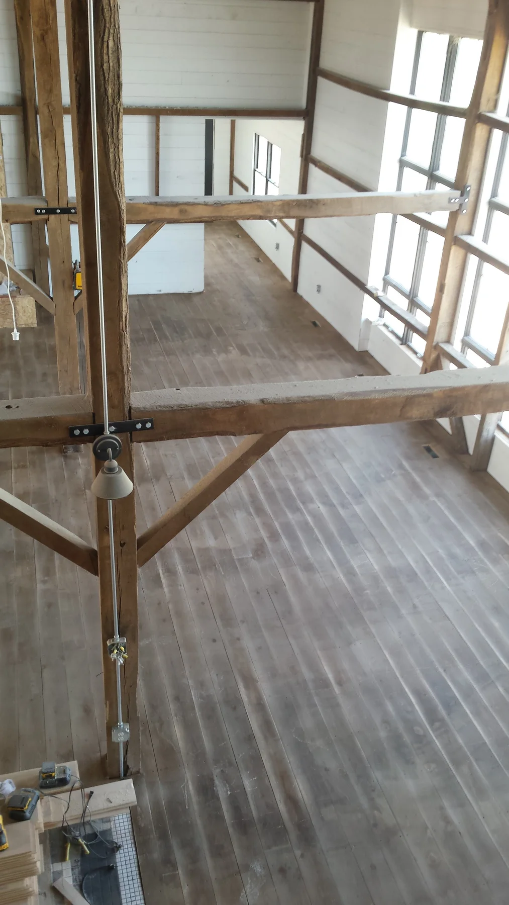 Floor work inside the barn during the finish stage.