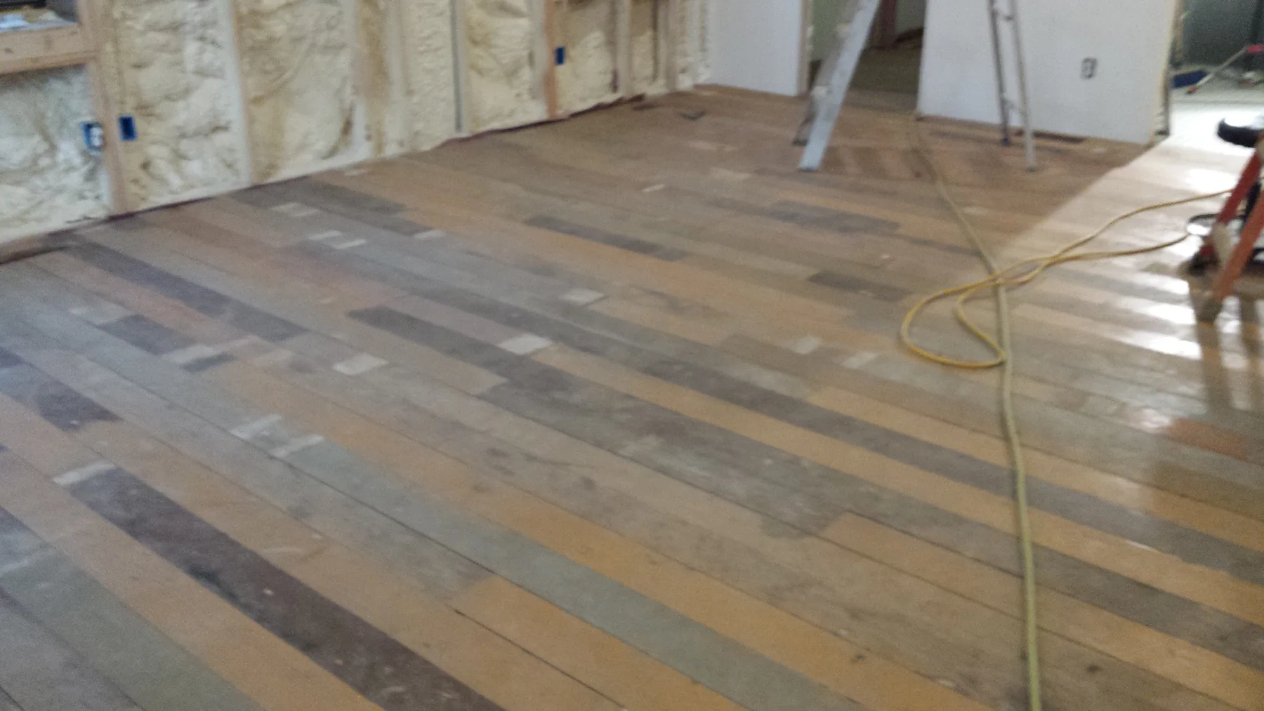 The wood floor after another stretch of installation.