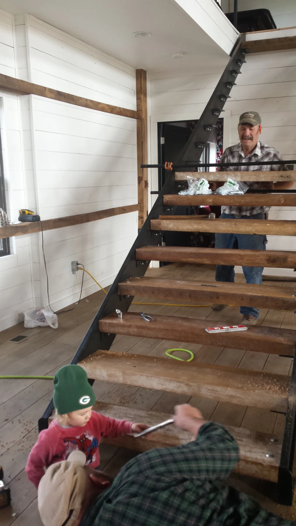 Stair pieces coming together inside the open frame.