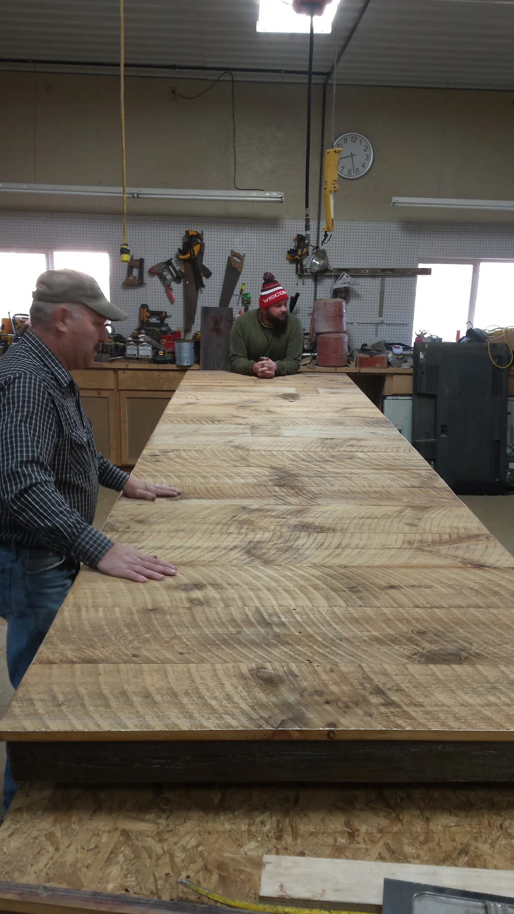 Mark working across the table top in the shop.