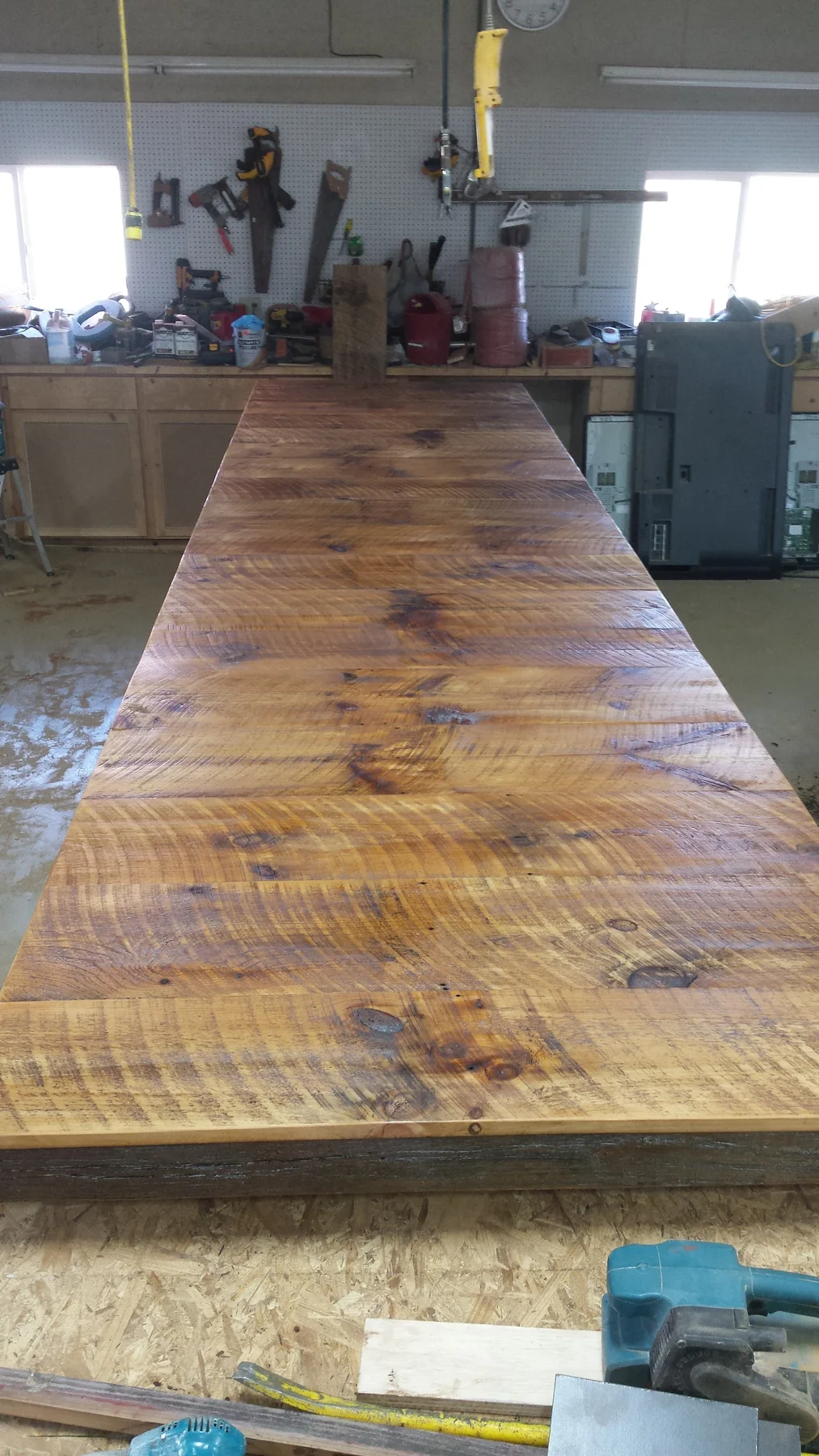 The table top after finish brought out the saw marks and grain.