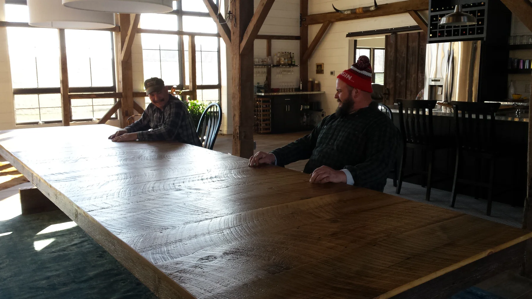 The long table set into the barn living space.