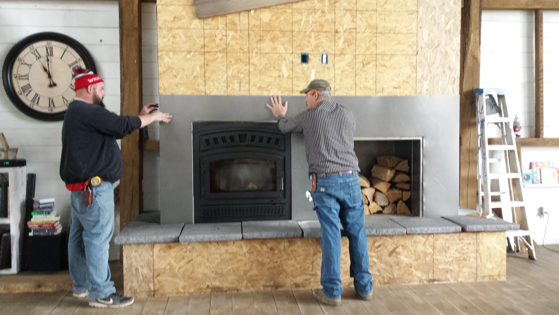The fireplace surround at the start of the barn-board work.