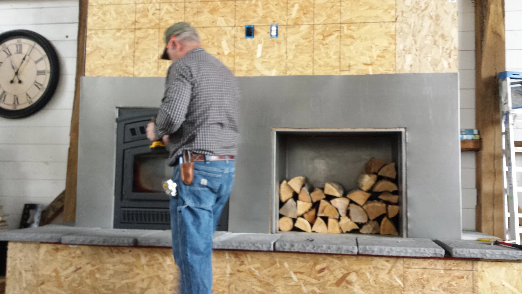 Fitting the fireplace surround around the firebox.