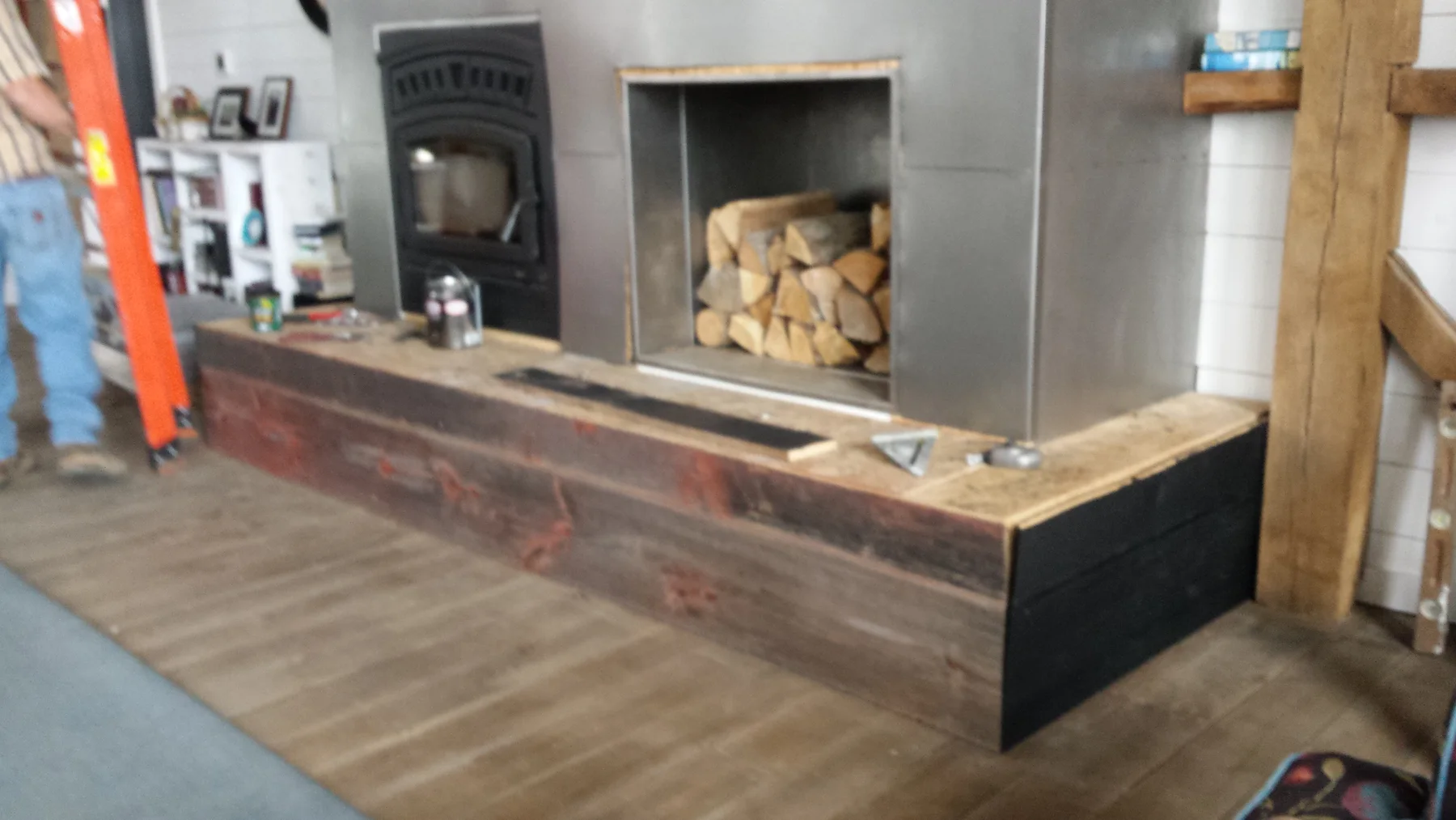Barn boards wrapping the finished fireplace face.