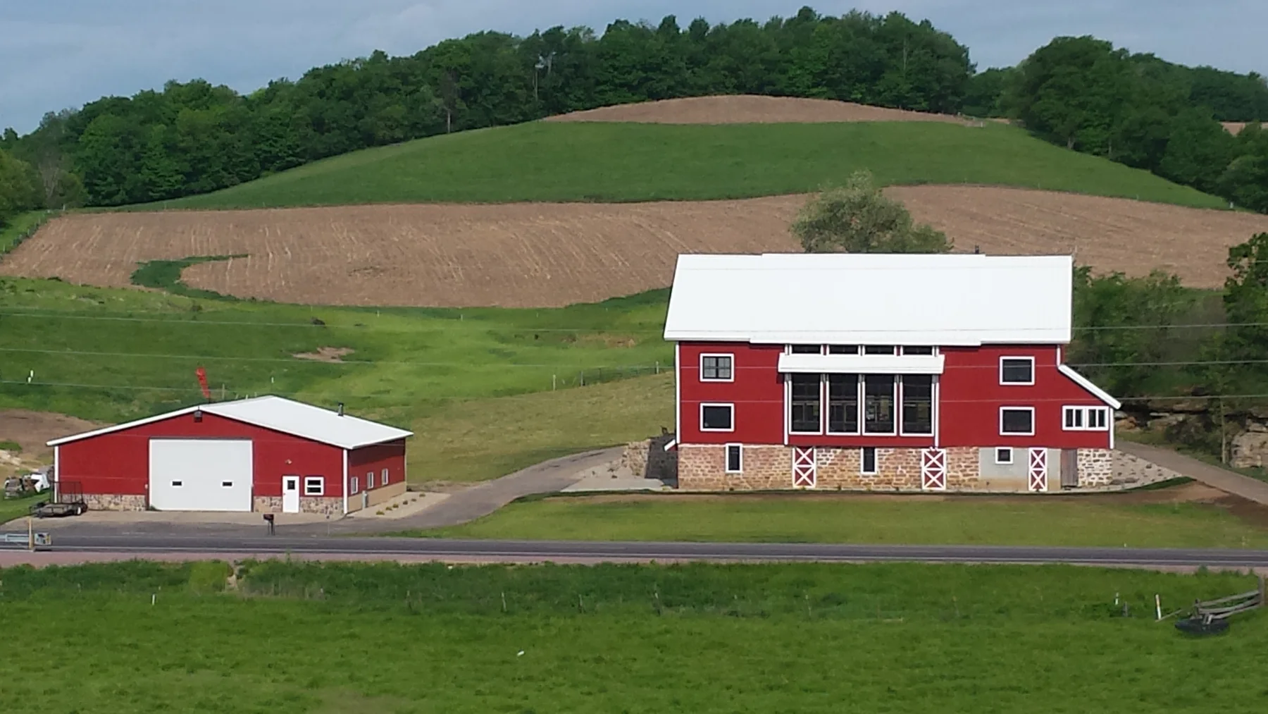 The renovated barn and surrounding fields.
