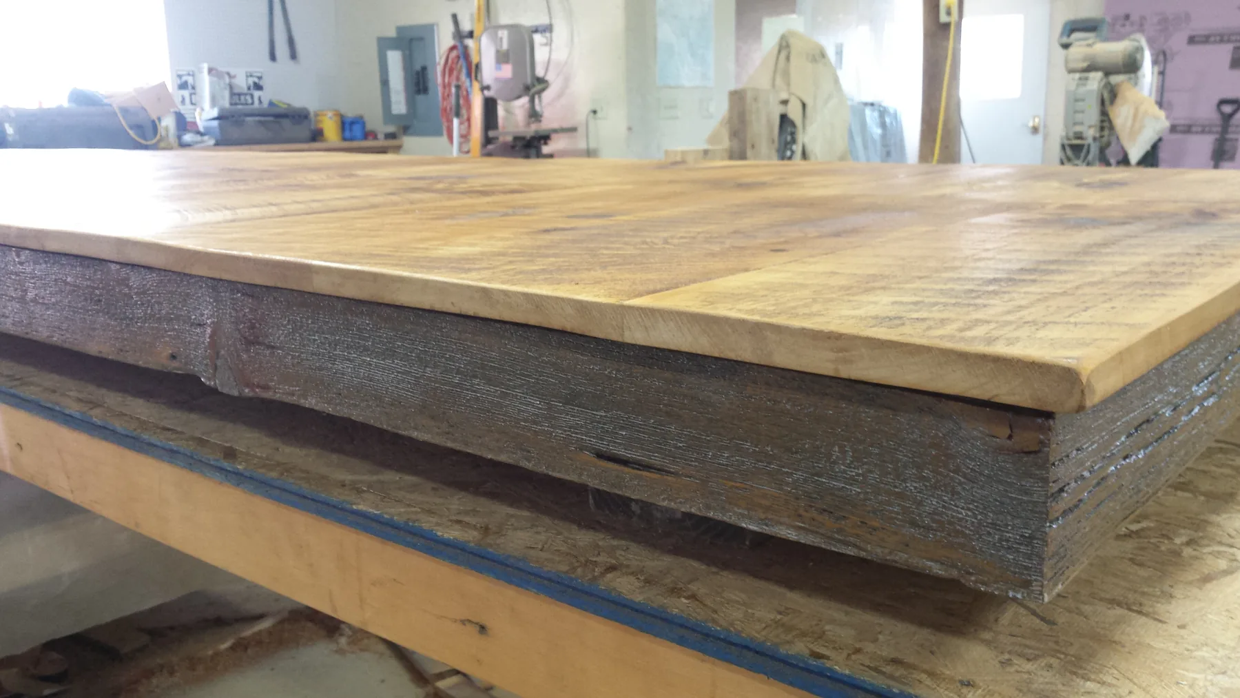 The dining table top built from flipped lean-to barn boards